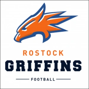 Küchenstudio Das Logo der Rostock Griffins Football-Mannschaft zeigt einen orange-blauen Greifenkopf über dem Teamnamen in Fettschrift, präsentiert in Zusammenarbeit mit dem Lieblingsküchen Küchenstudio. Küchenstudio Das Logo der Rostock Griffins Football-Mannschaft zeigt einen orange-blauen Greifenkopf über dem Teamnamen in Fettschrift, präsentiert in Zusammenarbeit mit dem Lieblingsküchen Küchenstudio.